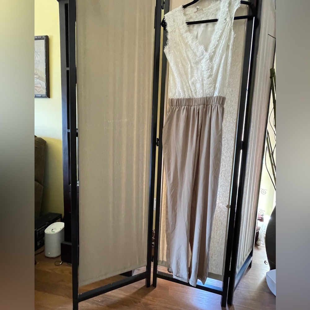 White and Tan Sleeveless V-Neck Jumpsuit.